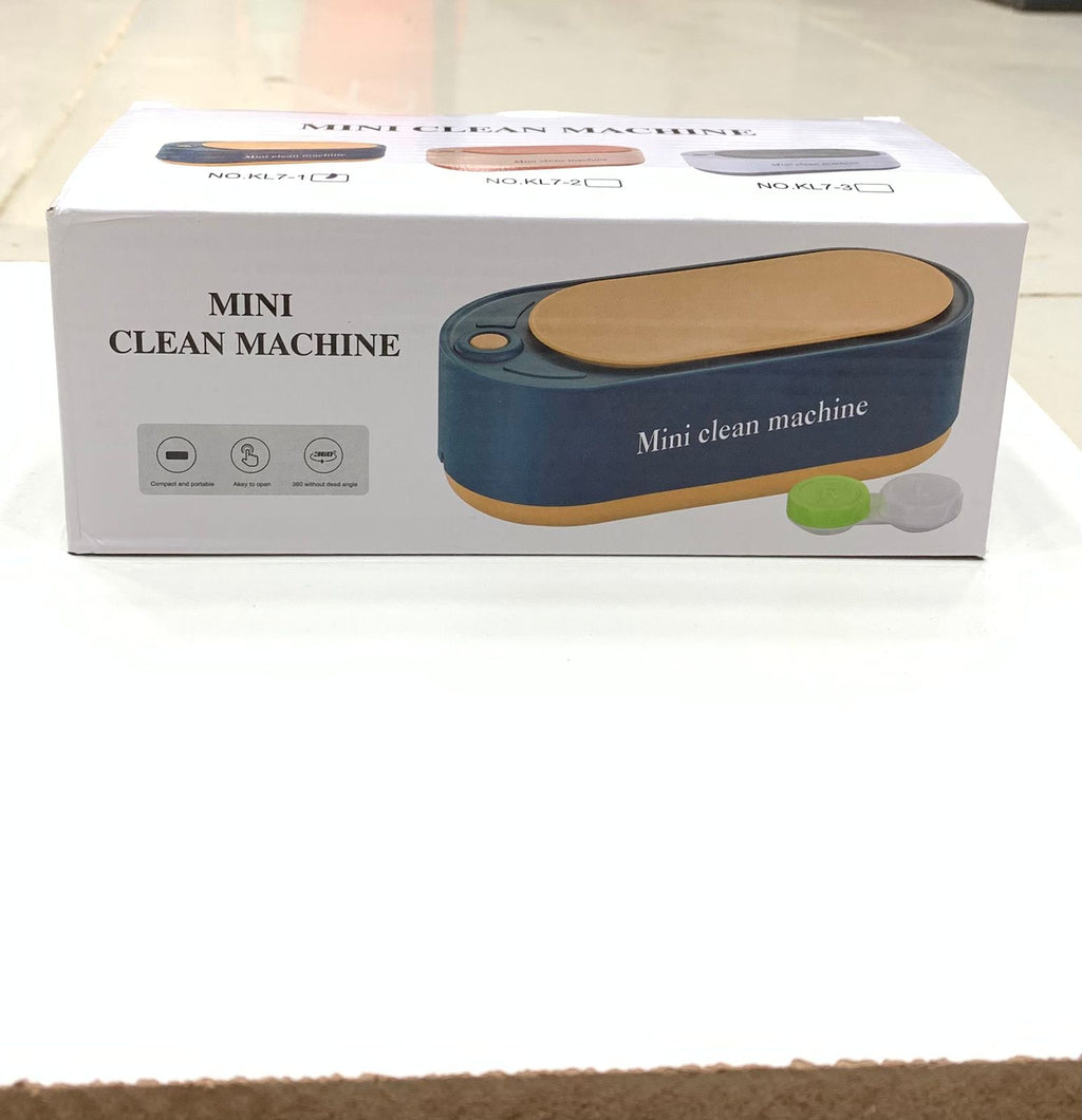 Box of a mini clean machine on a white surface