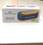 Box of a mini clean machine on a white surface