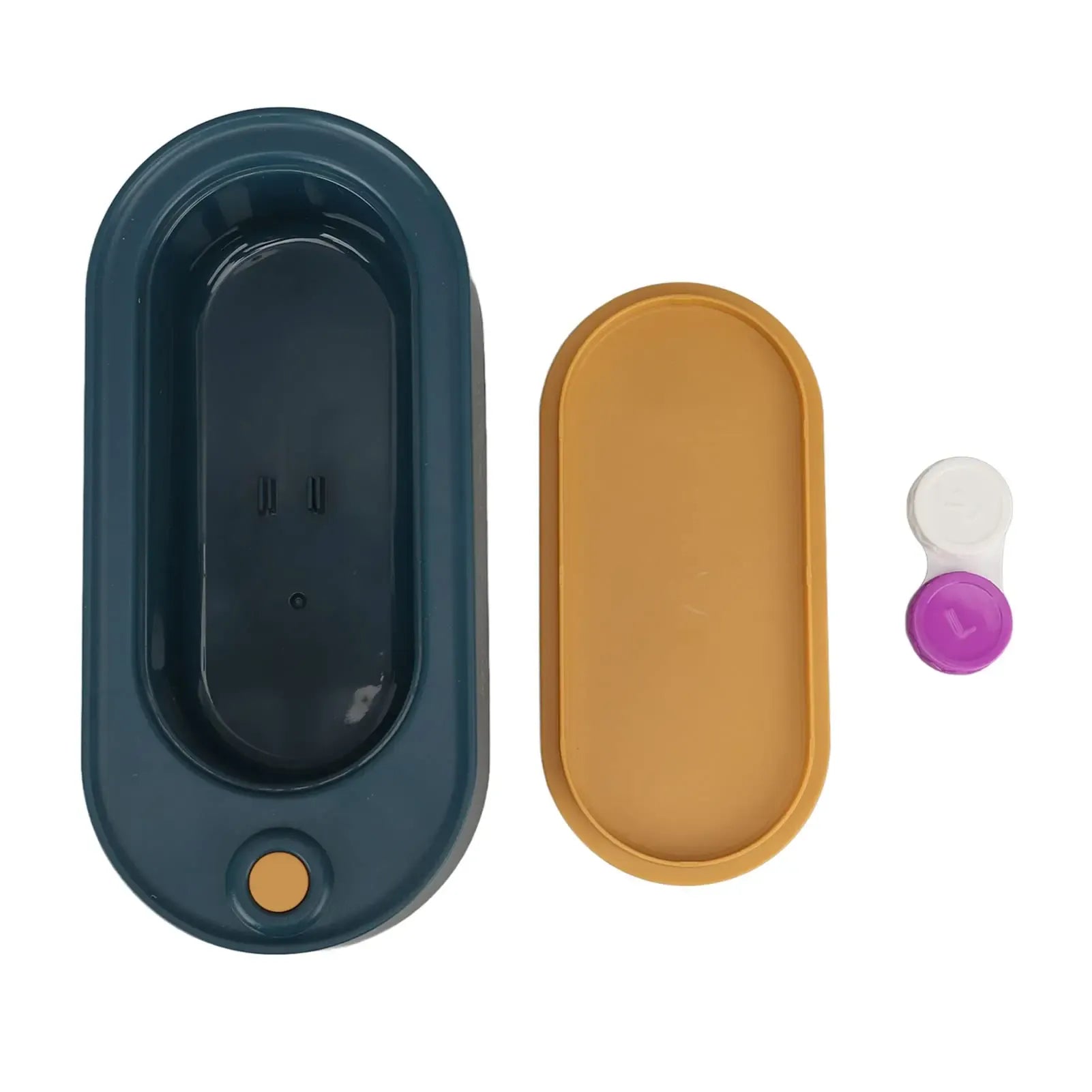 Two oval-shaped silicone lids, one dark blue and one mustard yellow, with a small purple and white object on a white background.