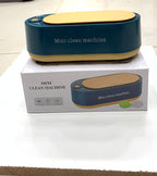 Mini clean machine with packaging on a white surface