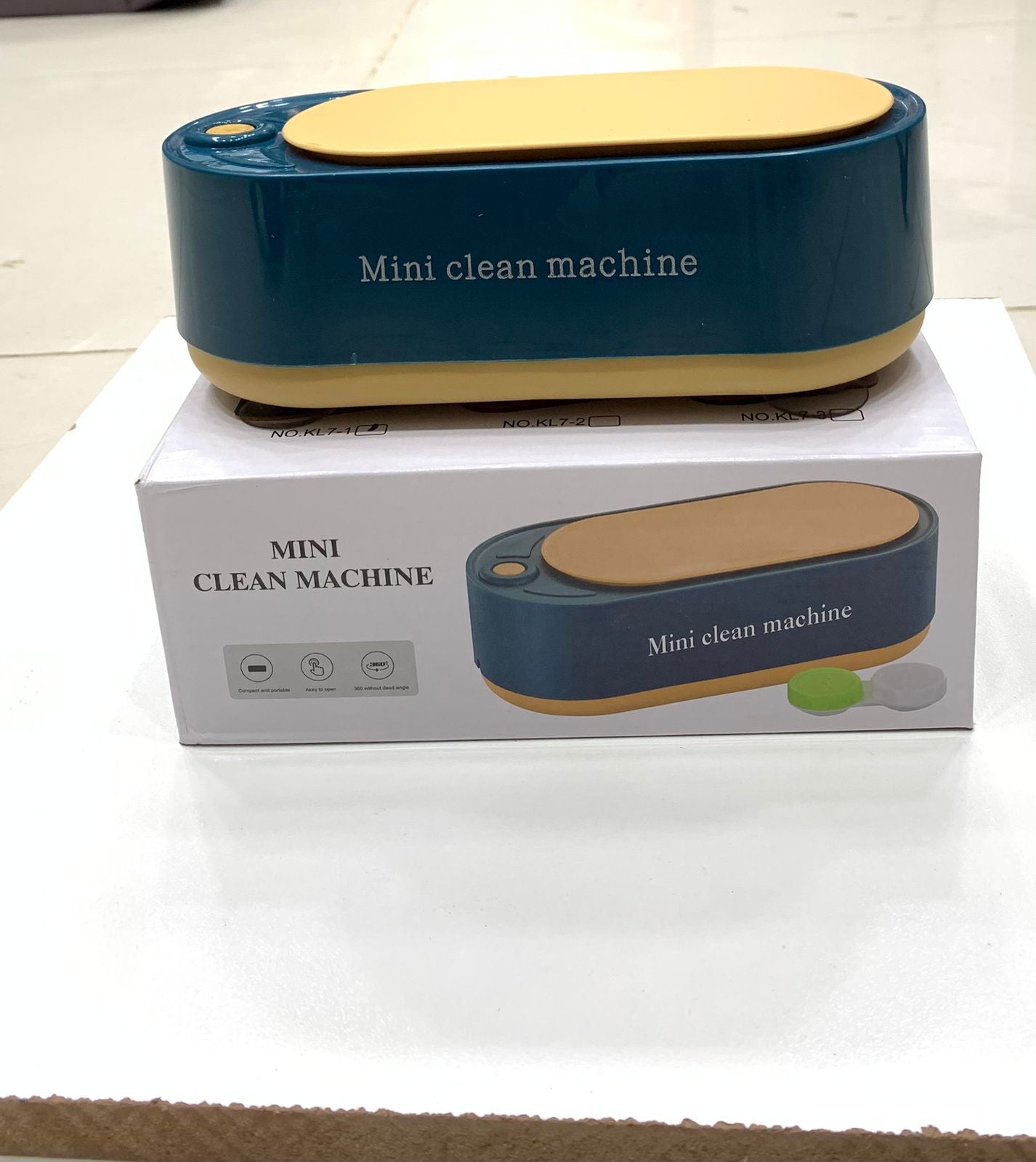 Mini clean machine with packaging on a white surface