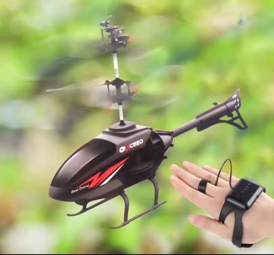 Black remote control helicopter with a blurred green background