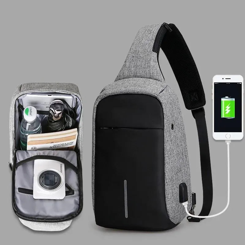 Gray crossbody bag with smartphone charging feature on a gray background