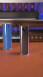 2-in-1 spray screen cleaner removing fingerprints from phone and laptop screens.